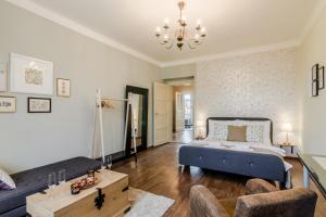 a bedroom with a bed and a living room at APT with sunny garden Prague by Michal&Friends in Prague