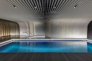 a swimming pool in a room with at SKYE Suites Sydney in Sydney