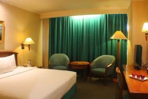 Letto o letti in una camera di Grand Arkenso Park View