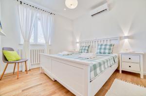 Säng eller sängar i ett rum på Luxury 5* Apartment by Guide & Sleep