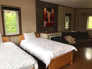 Katil atau katil-katil dalam bilik di Slowlife Lodge +1 gambar