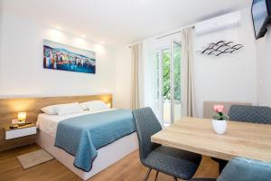 Posteľ alebo postele v izbe v ubytovaní Lugo Apartments
