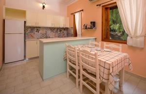 A kitchen or kitchenette at Alykes Park Bungalows