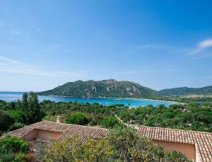 a view of a large body of water with trees at Résidence Les Hameaux de Santa Giulia in Porto-Vecchio