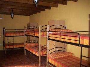 a group of bunk beds in a room at Albergue Estrella Del Camino in Frómista