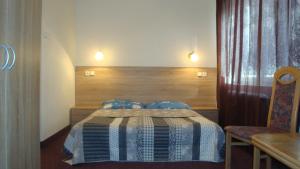 Postel nebo postele na pokoji v ubytování Penzion u Fouska