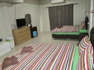 Postel nebo postele na pokoji v ubytování Pineapple Guesthouse