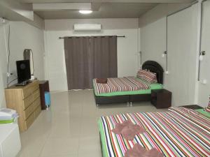 Postel nebo postele na pokoji v ubytování Pineapple Guesthouse
