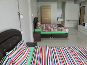 Postel nebo postele na pokoji v ubytování Pineapple Guesthouse