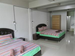 Postel nebo postele na pokoji v ubytování Pineapple Guesthouse