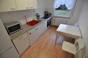 Kuchyň nebo kuchyňský kout v ubytování Apartments Hemer