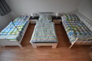 Łóżko lub łóżka w pokoju w obiekcie Apartments Hemer
