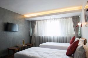 Letto o letti in una camera di Potala Guest House
