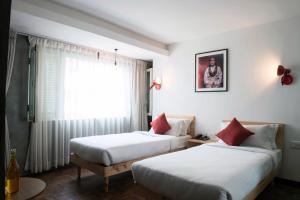 Letto o letti in una camera di Potala Guest House
