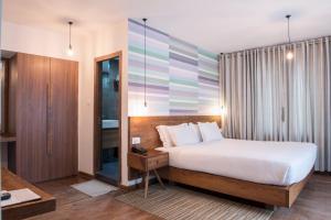 Letto o letti in una camera di Potala Guest House