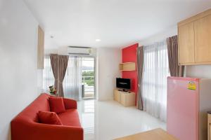 TV a/nebo společenská místnost v ubytování C-House & Residence Hotel Amata City