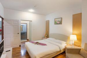 Postel nebo postele na pokoji v ubytování C-House & Residence Hotel Amata City