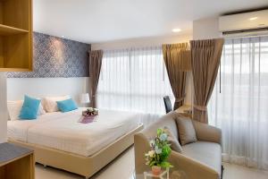 Postel nebo postele na pokoji v ubytování C-House & Residence Hotel Amata City