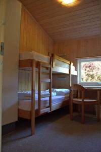 Katil dua tingkat atau katil-katil dua tingkat dalam bilik di Ferienhaeuser Am Waldrand