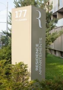 a sign for a building with the number on it at Residence Appartements in Zürich