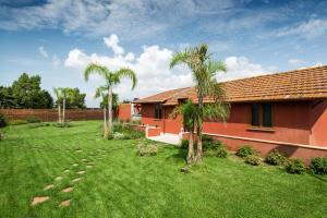 Vonkajšia záhrada v ubytovaní Domus Porto Di Traiano Resort