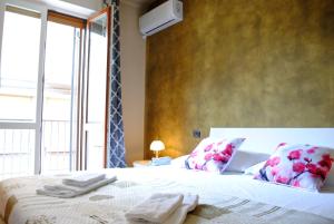 Posteľ alebo postele v izbe v ubytovaní Dreaming Piazza Bra Rooms