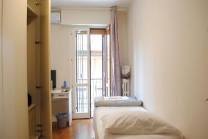 Posteľ alebo postele v izbe v ubytovaní Dreaming Piazza Bra Rooms
