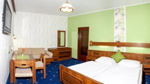 Postel nebo postele na pokoji v ubytování Pension Wienerstub'n