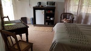 Posezení v ubytování Swallowfield Rondavels + 15 fotografií