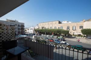 a view of a city street from a balcony at Versomare in Polignano a Mare