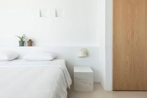 Postel nebo postele na pokoji v ubytování Santorini Heights