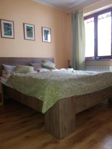 Łóżko lub łóżka w pokoju w obiekcie Dom Gościnny "Pod Siódemką"