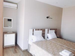 Postel nebo postele na pokoji v ubytování Dream Tower