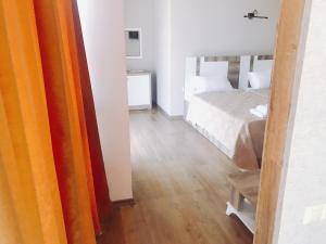 Postel nebo postele na pokoji v ubytování Dream Tower