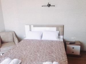 Postel nebo postele na pokoji v ubytování Dream Tower