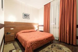 Postel nebo postele na pokoji v ubytování Viva Hotel