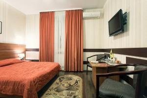 Postel nebo postele na pokoji v ubytování Viva Hotel