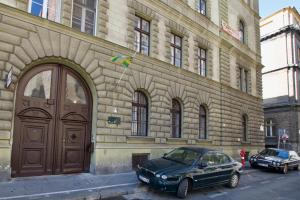 a car parked in front of a building with a door at St King 11 by Hi5 Apartments in Budapest