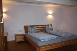 Postel nebo postele na pokoji v ubytování Landhaus Hui Wäller
