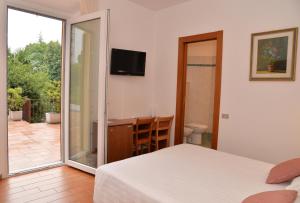 TV a/nebo společenská místnost v ubytování Hotel Quarcino