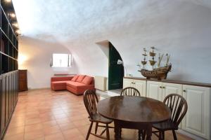 a living room with a table and a couch at Le Tartarughe Boutique Apartment in Rome +13 photos