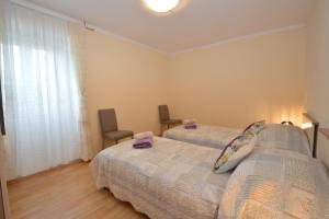 Posteľ alebo postele v izbe v ubytovaní Apartment Hrasta
