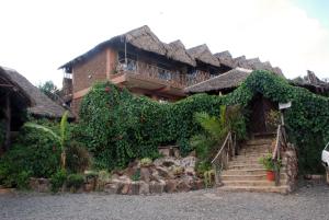 a house with ivy growing on the side of it at Osoita Lodge in Nairobi