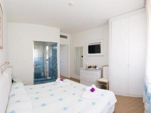 Postel nebo postele na pokoji v ubytování Hotel Palau