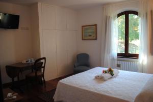 Ένα ή περισσότερα κρεβάτια σε δωμάτιο στο La Casa dei Vezzi