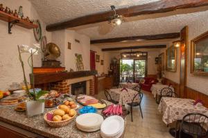 a living room with a table with food on it at Villarosybeb in Paruzzaro