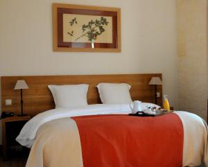 מיטה או מיטות בחדר ב-Le Clos Barisseuse