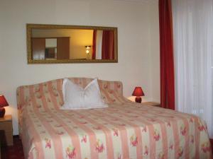 Postel nebo postele na pokoji v ubytování Hotel Winzerverein