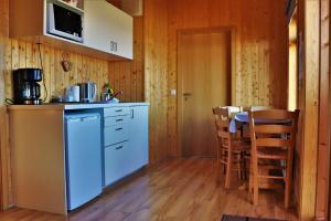 A kitchen or kitchenette at Fossatún Sunset Cottage