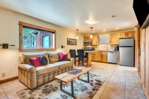 a living room filled with furniture and a kitchen at Wall Street Suites in Bend